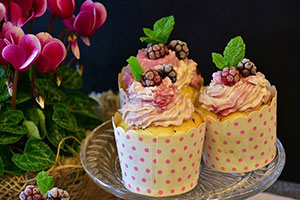 pink frosting cupcakes with berries